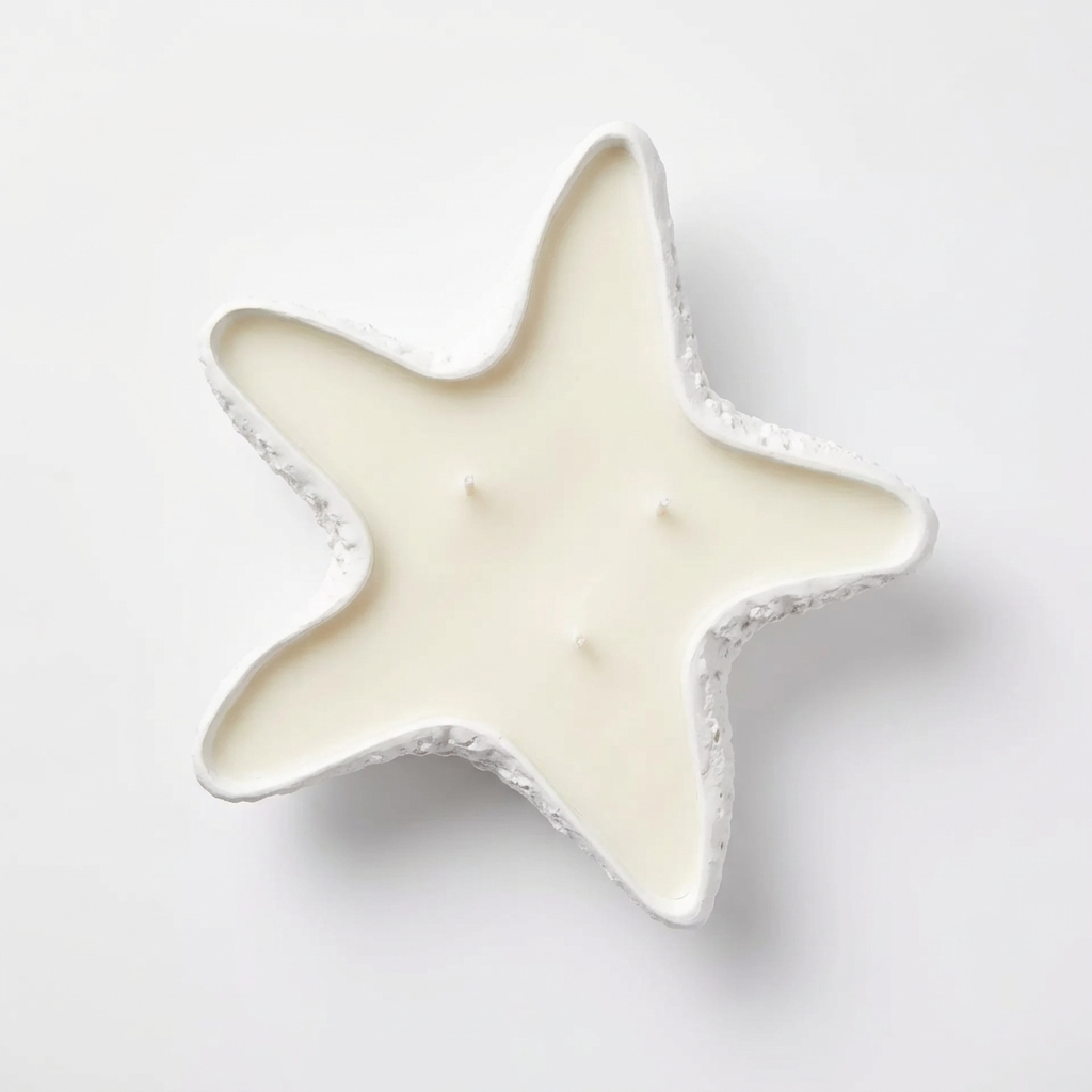 Vela decorativa artesanal en recipiente con forma de estrella